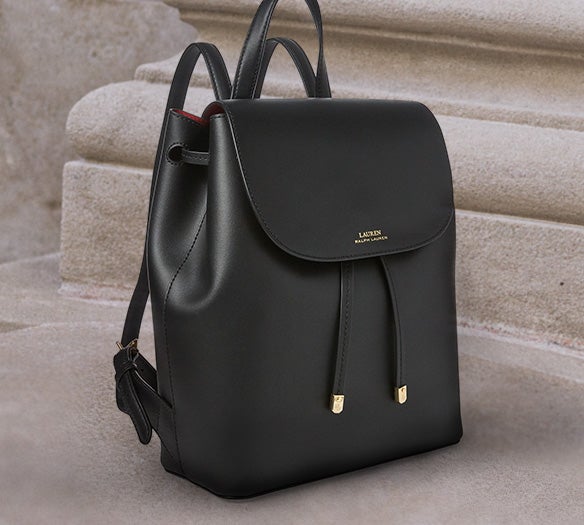 Black leather backpack with front flap drawstring closure