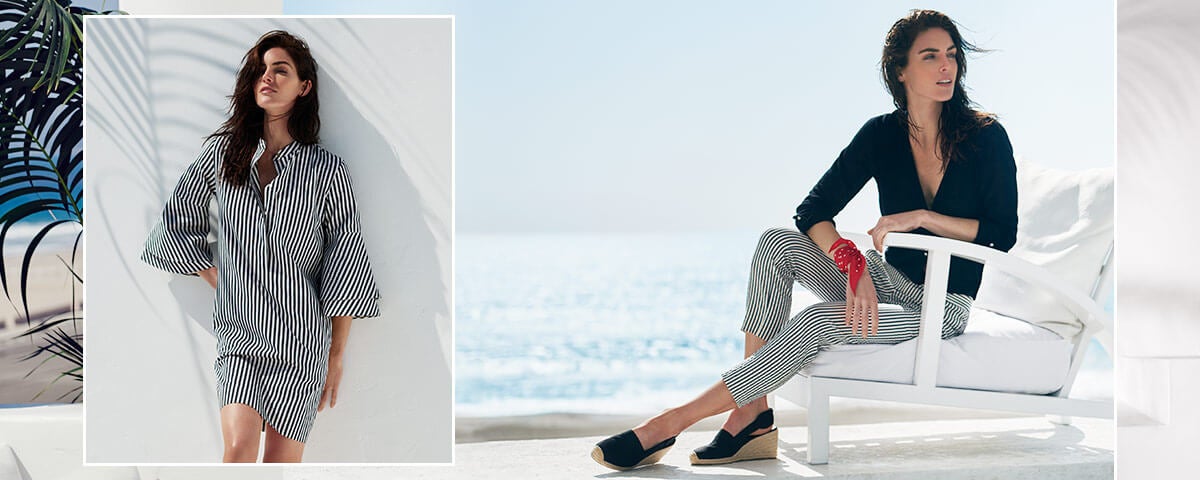 Model Hilary Rhoda in striped shirtdress & striped blazer